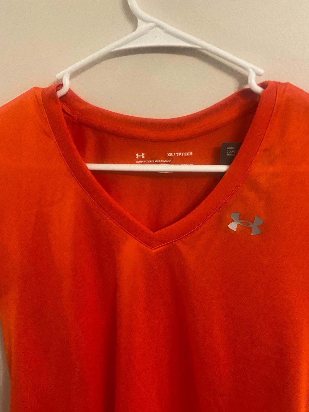 Under Armour womens V-Neck Athletic Shirt — Bright Orange with Silver Logo